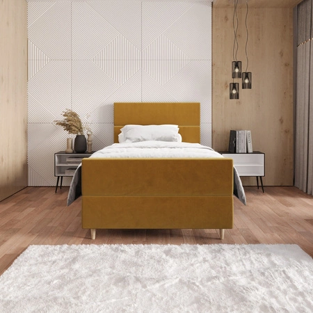 Kontinentální postel Benet 100x200 hořčice v moderním skandinávském stylu s čalouněným podhlavníkem a podnožkou s úložným boxem