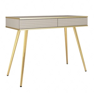 Luxusní béžová konzola se zásuvkami elegantní toaletní stolek s drážkovanými čely vysoké zlaté nohy tělo doplněné zlatým lemováním