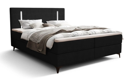 Kontinentální postel Norco 140x200 černá Stylová postel s úložným prostorem na lůžkoviny Osvětlení v čele postele dodává jedinečný nádech
