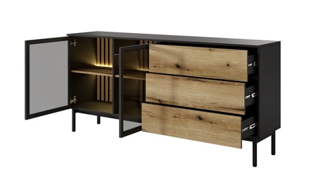 Komoda Clovis 180 cm černá / dub evokuje netradiční design komody s prosklenými čely se systémem push to open