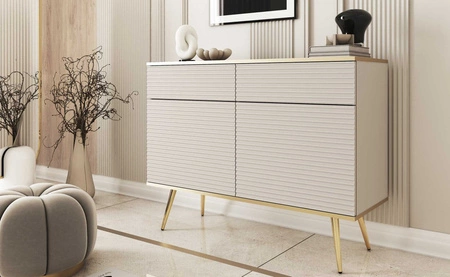 Luxusní 107 cm zásuvková komoda béžové barvy stylová komoda s drážkovanými čely korpus doplněný zlatým lemováním zlaté kovové nohy