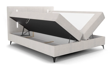 Kontinentální postel Norco 180x200 ecru Stylová postel s osvětlením kontejneru na ložní prádlo v čele postele dodává jedinečný nádech