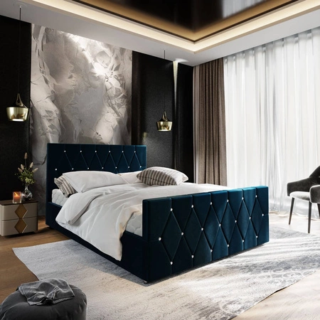 Čalouněná postel Tifton 140x200 v tmavě modré barvě s úložným boxem v moderním stylu s výrazným čelem a nohama s povrchovou úpravou krystaly
