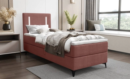 Kontinentální postel Norco 90x200 růžová Stylová postel s úložným prostorem na lůžkoviny Osvětlení v čele postele dodává jedinečný nádech