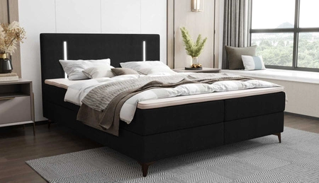 Kontinentální postel Norco 140x200 černá Stylová postel s úložným prostorem na lůžkoviny Osvětlení v čele postele dodává jedinečný nádech