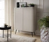 Béžová komoda Zoya 103 cm elegantní design oválného tvaru na černých kovových nohách vkusné drážkované čelo