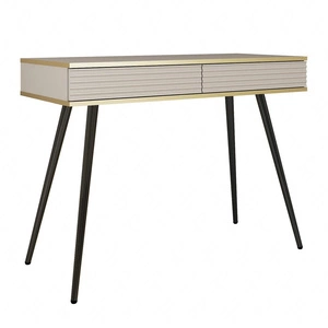 Luxusní béžová konzola se zásuvkami elegantní toaletní stolek s drážkovanými čely vysoké černé nohy tělo doplněné zlatým lemováním