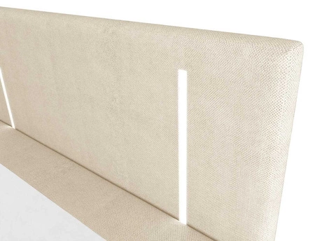 Kontinentální postel Norco 160x200 béžová Stylová postel s úložným prostorem na lůžkoviny Osvětlení v čele postele dodává posteli jedinečný nádech