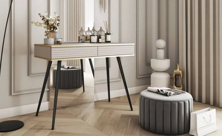 Luxusní béžová konzola se zásuvkami elegantní toaletní stolek s drážkovanými čely vysoké černé nohy tělo doplněné zlatým lemováním