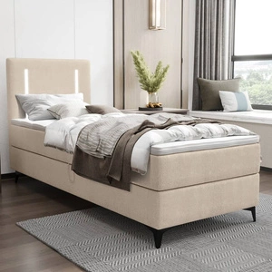 Kontinentální postel Norco 80x200 béžová Stylová postel s úložným prostorem na lůžkoviny Osvětlení v čele postele dodává posteli jedinečný nádech
