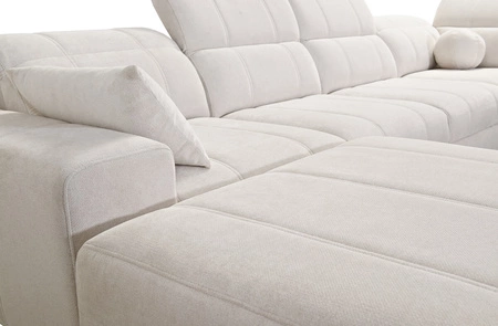 Rohová pohovka s funkcí spaní Penejos IV Lux modrá levostranná stylová rohová pohovka s pohodlným výsuvným podnožníkem