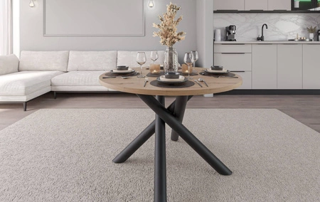Kulatý stůl Lyon 110 cm dub artisan / černý designový jídelní stůl na kovových pavoučích nohách výškově nastavitelný