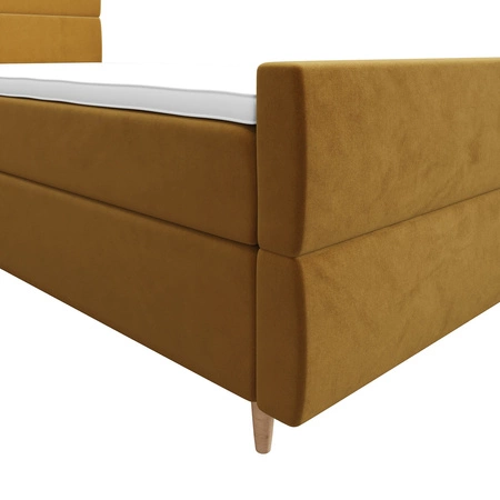 Kontinentální postel Benet 100x200 hořčice v moderním skandinávském stylu s čalouněným podhlavníkem a podnožkou s úložným boxem