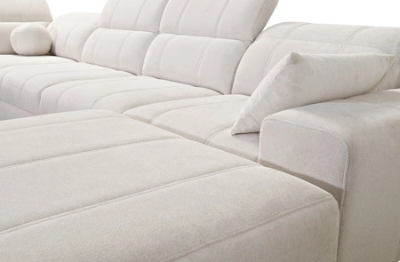 Rozkládací pohovka Penejos IV Lux světle šedá pravostranná stylová rohová rozkládací pohovka s pohodlným výsuvným podnožníkem