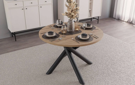 Kulatý stůl Lyon 110 cm dub artisan / černý designový jídelní stůl na kovových pavoučích nohách výškově nastavitelný