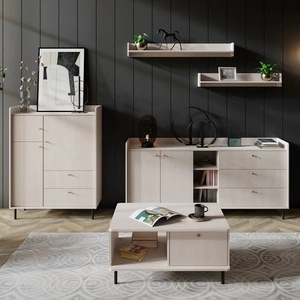 Nábytková sestava Ferdi béžová písková minimalistický design nástěnných skříněk do obývacího pokoje zlaté úchytky korpusy přesahující linii stolových desek